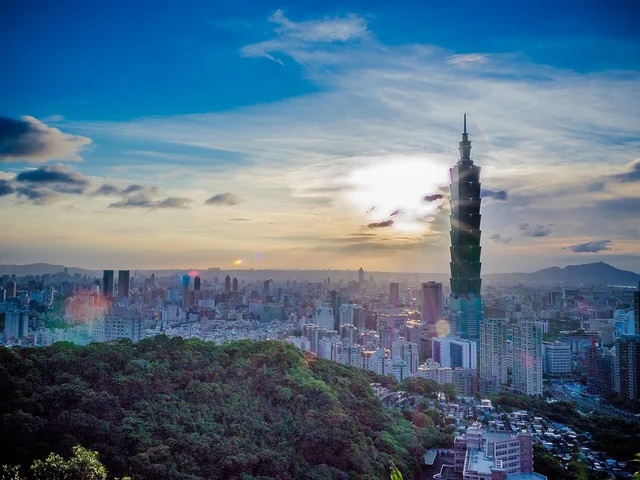 Taipei 101 and the city skyline at sunset.