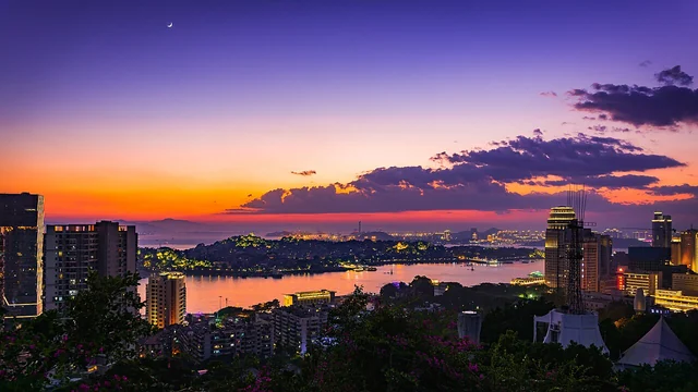 Gulangyu across the water at dusk, seen from the Xiamen waterfront.