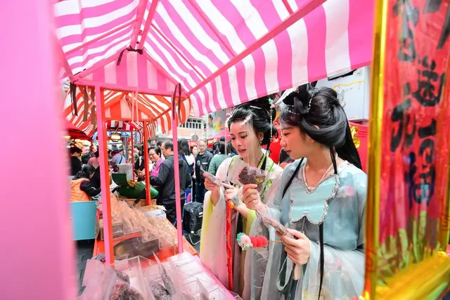 Visitors in Hanfu at a New Year market in Hong Kong, February 2024.