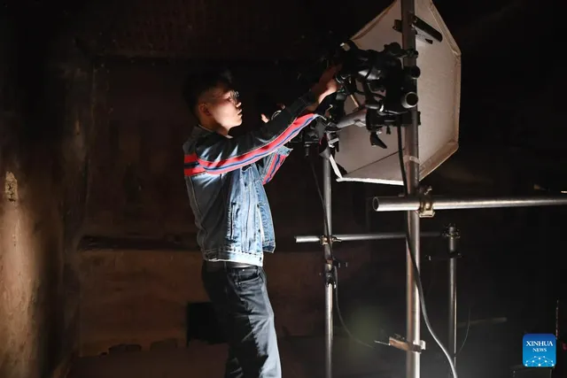 Preparing to photograph a Mogao mural, 25 April 2023.