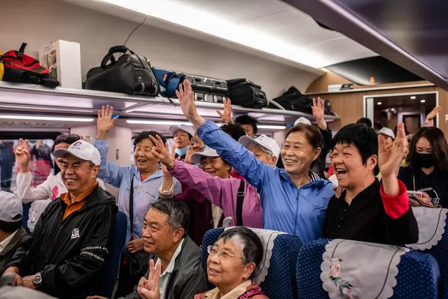 Passengers on the first cross-border service, 13 April 2023.