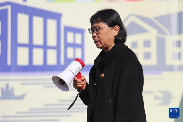 Zhang Guimei leads a school break activity in Huaping, 26 February 2024.