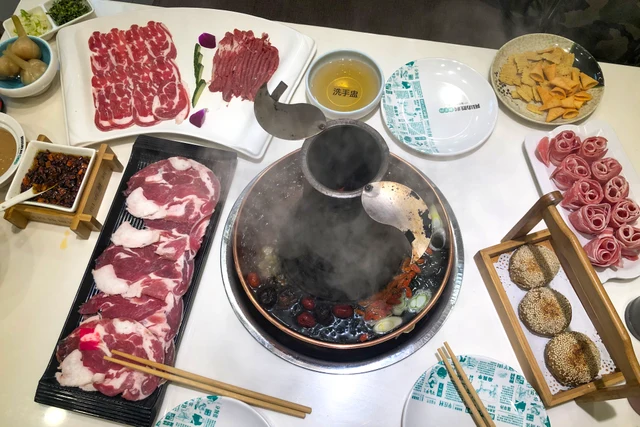 A copper hotpot prepared for instant-boiled mutton in Beijing.