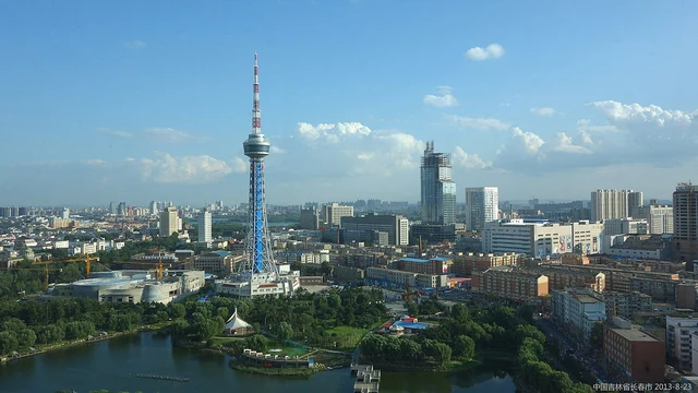 Changchun’s skyline with Ji Tower photographed in August 2013; not a current weather or construction view.