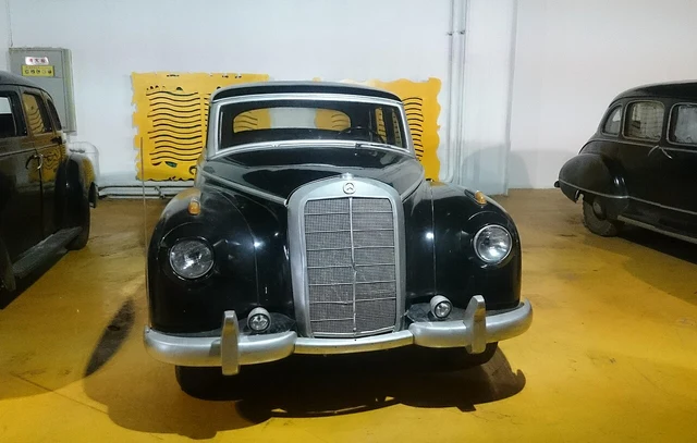 A historic car display inside the former Changchun Film Studio museum; the source does not identify a particular film or the vehicle’s filming history.