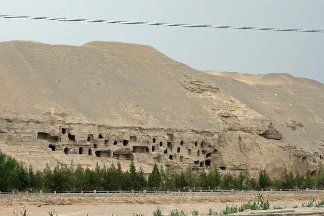 The exterior cliff and chambers of the Mogao Caves near Dunhuang.
