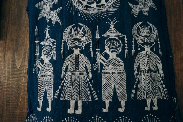 Miao wax-resist textiles photographed in Guizhou in 2016; a regional example, not the excavated egret-pattern dress.
