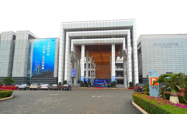 The Hainan Museum in Haikou; an exterior photograph, distinct from the adjacent Chronicles Museum and Wuzhishan’s ethnology museum.