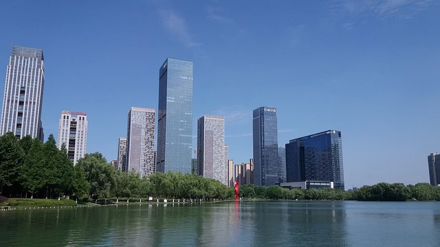 Hefei’s skyline around Swan Lake photographed in June 2019; not a current weather or building-status view.