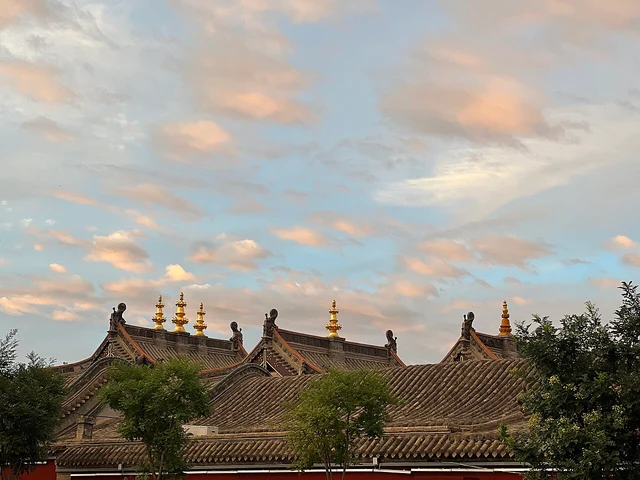 Dazhao Temple roofs and evening clouds in Hohhot photographed in July 2023; not a current weather or access view.