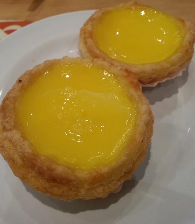 Two Hong Kong-style egg custard tarts.