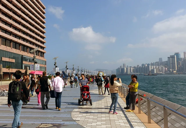 The pedestrian waterfront at the Tsim Sha Tsui Promenade and Avenue of Stars.