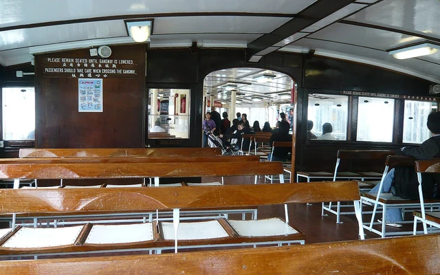 Wooden passenger benches inside a Star Ferry.