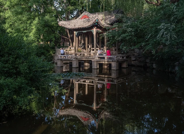 A pavilion and spring-garden setting at Baotu Spring Park, Jinan, photographed in May 2015.