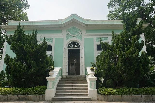 A green Portuguese-style house at the Taipa Houses, Macao.