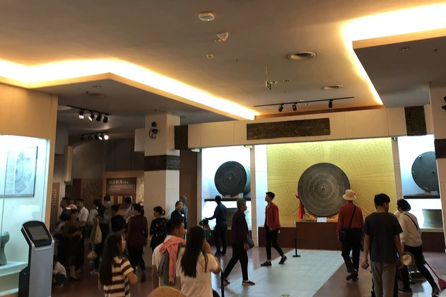 The bronze-drum gallery at the Anthropology Museum of Guangxi; a historical exhibition photograph.