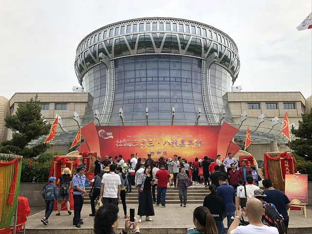 A historical exterior photograph of the Anthropology Museum of Guangxi on Qinghuan Road.