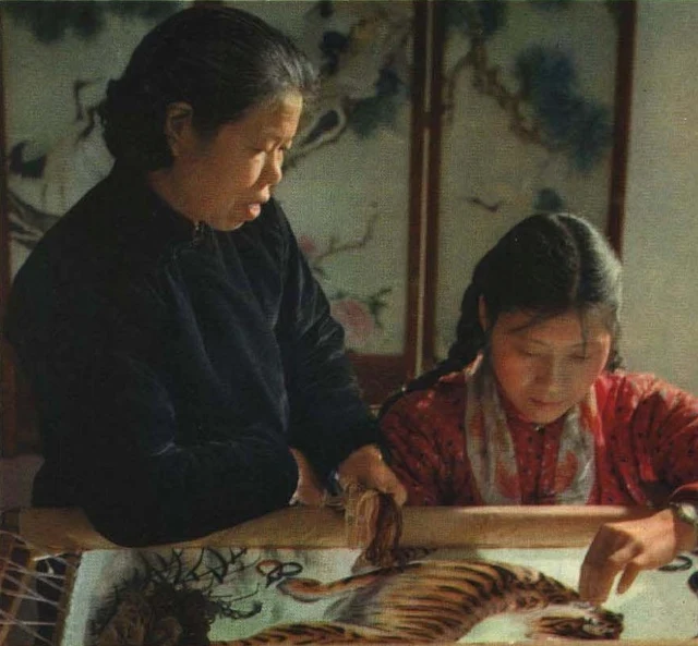 Artisans working on Xiang embroidery in an archival 1963 photograph.