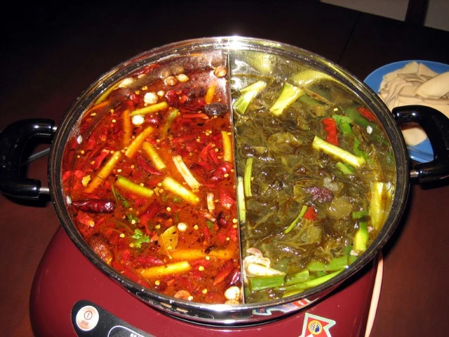 A Chengdu-style divided hotpot with red spicy broth and a milder broth.