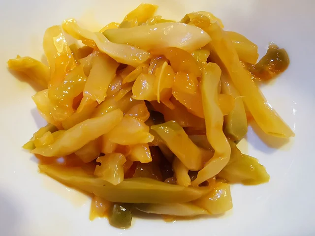 Sliced Wujiang Fuling pickled mustard stems served on a plate.