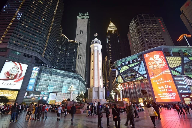 Chongqing Liberation Monument and the surrounding shopping district at night.