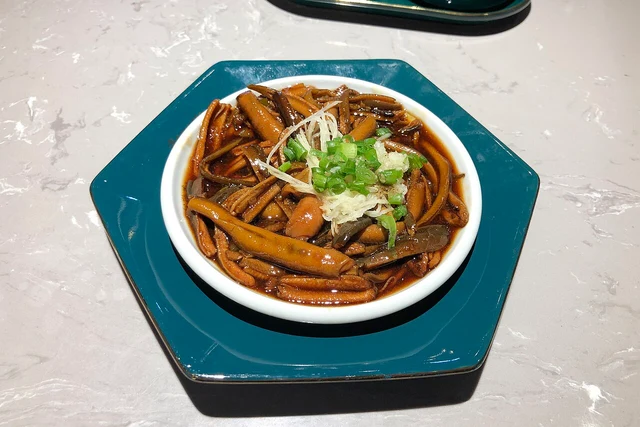 Shredded eel stir-fried with hot oil and ginger, at a Songhelou restaurant in Beijing in January 2021.