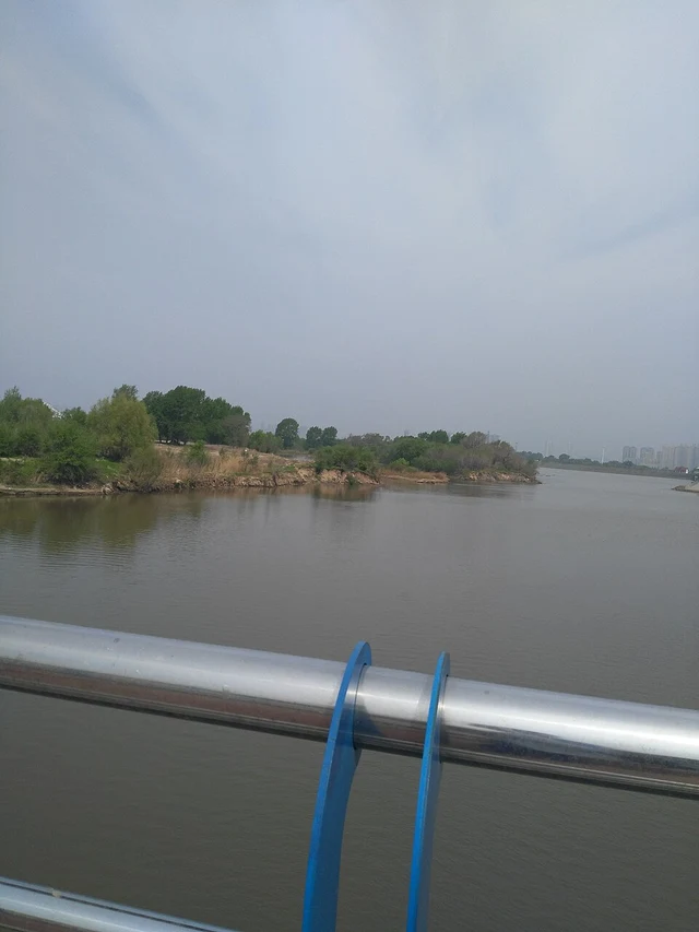 The Songhua River in Harbin seen from a riverside railing.
