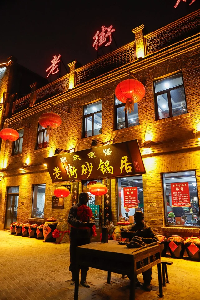 A lit shop facade in Harbin's Laodaowai Chinese Baroque district in 2025.