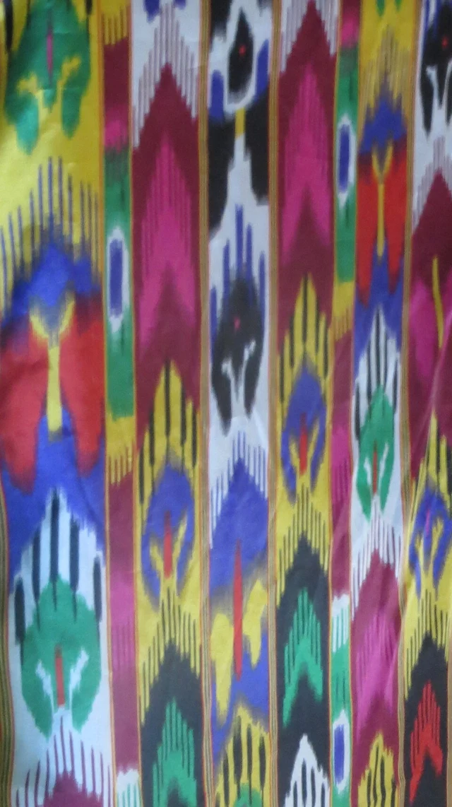 Brightly coloured ikat patterns on Aidelaisi silk fabric.