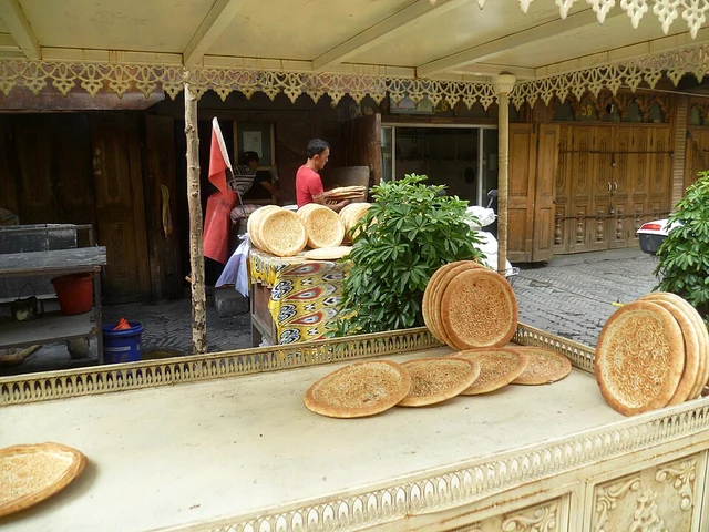 A bread stall and a baker inside Kashgar's old town.