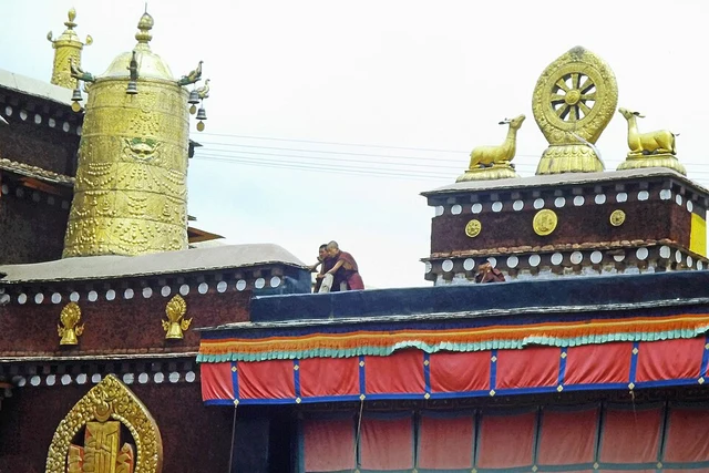 Golden Dharma-wheel and deer ornaments on the roof of Jokhang Temple in Lhasa.