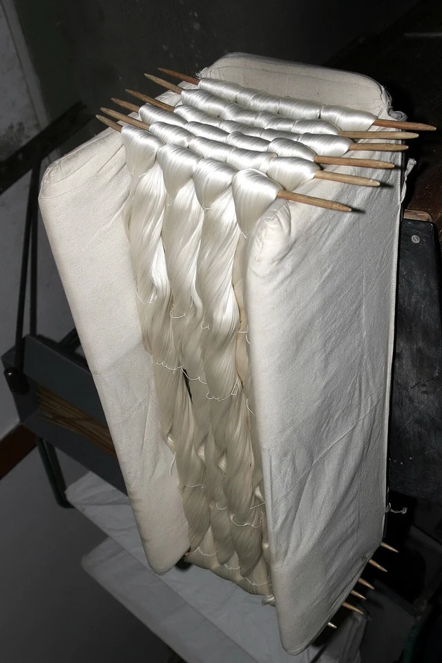 Bundles of raw silk hanging at Suzhou No. 1 Silk Mill.