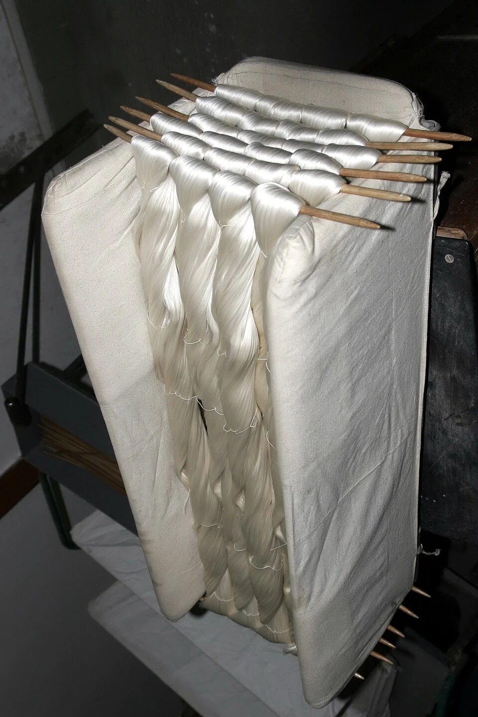Bundles of raw silk hanging at Suzhou No. 1 Silk Mill.