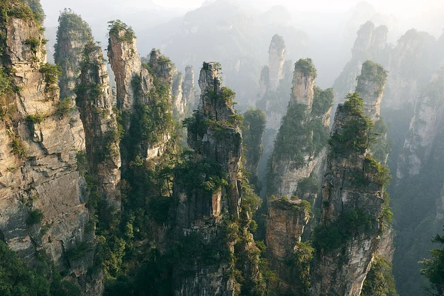 Forested sandstone pillars in Zhangjiajie National Forest Park in 2023.