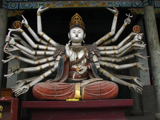 A many-armed painted figure in Shuanglin Temple near Pingyao.
