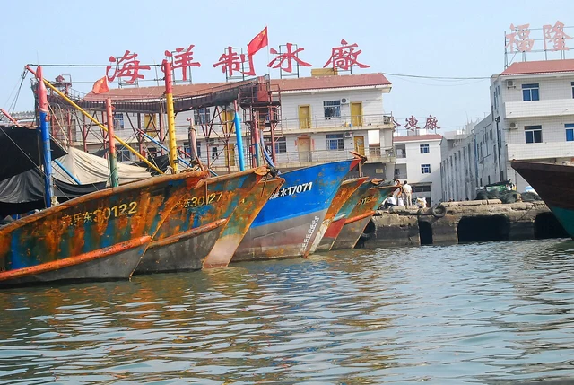 A historical Sanya Tanka fishing boat, as identified by the photographer; not a singing performance or a current boat booking.