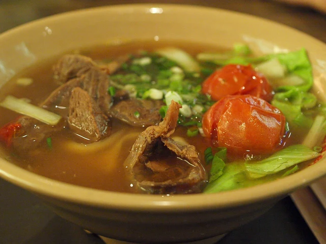 Tomato beef noodle soup photographed in Taipei; one broth variation.