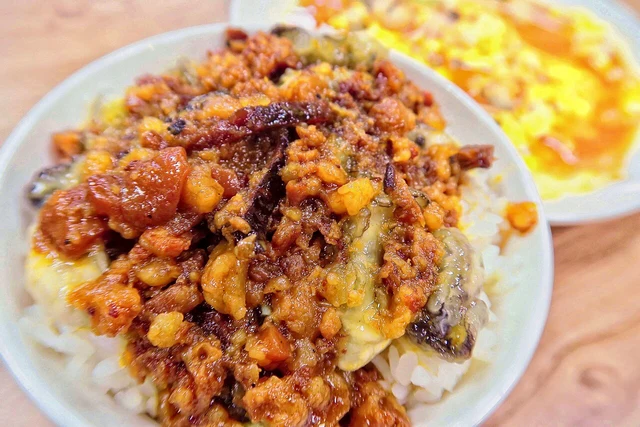 Oyster braised-pork rice photographed in Taipei; this variation adds oysters.