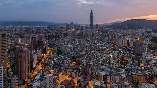 A stitched sunrise panorama of Taipei with Taipei 101.
