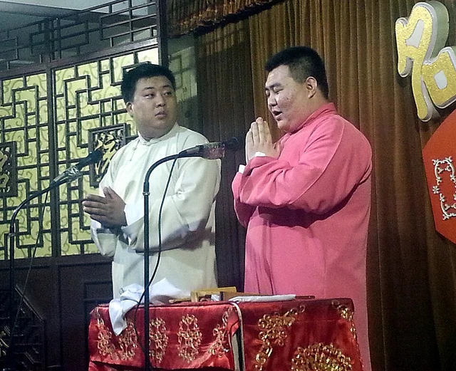 Crosstalk performers on a Tianjin theatre stage; this photograph is not a current programme.