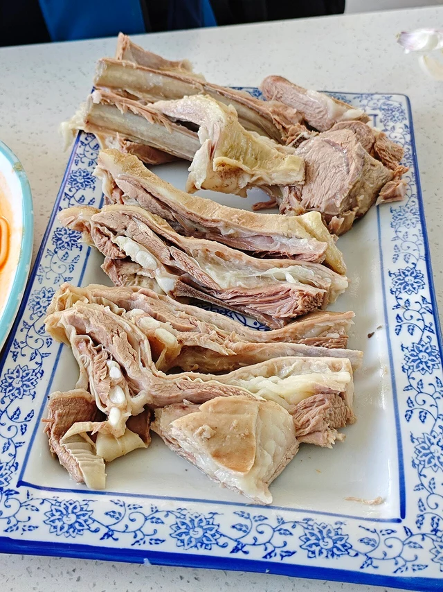 Qinghai hand-grab mutton photographed in Golmud in 2024, as a regional dish example.