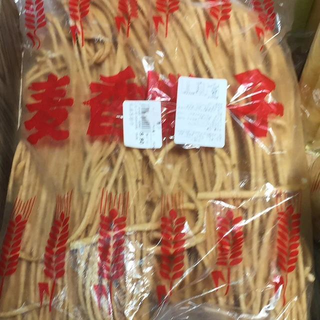 Bagged fried dough strands as a dish example; the source does not establish a Yinchuan venue or its recipe.