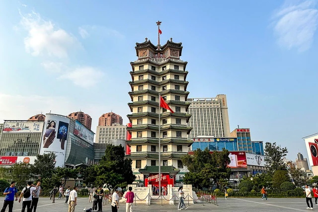 The complete Erqi Memorial Tower and surrounding square in Zhengzhou, photographed in September 2024.