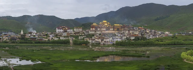 Songzanlin Monastery rises above the surrounding houses and fields near Shangri-La, Yunnan.
