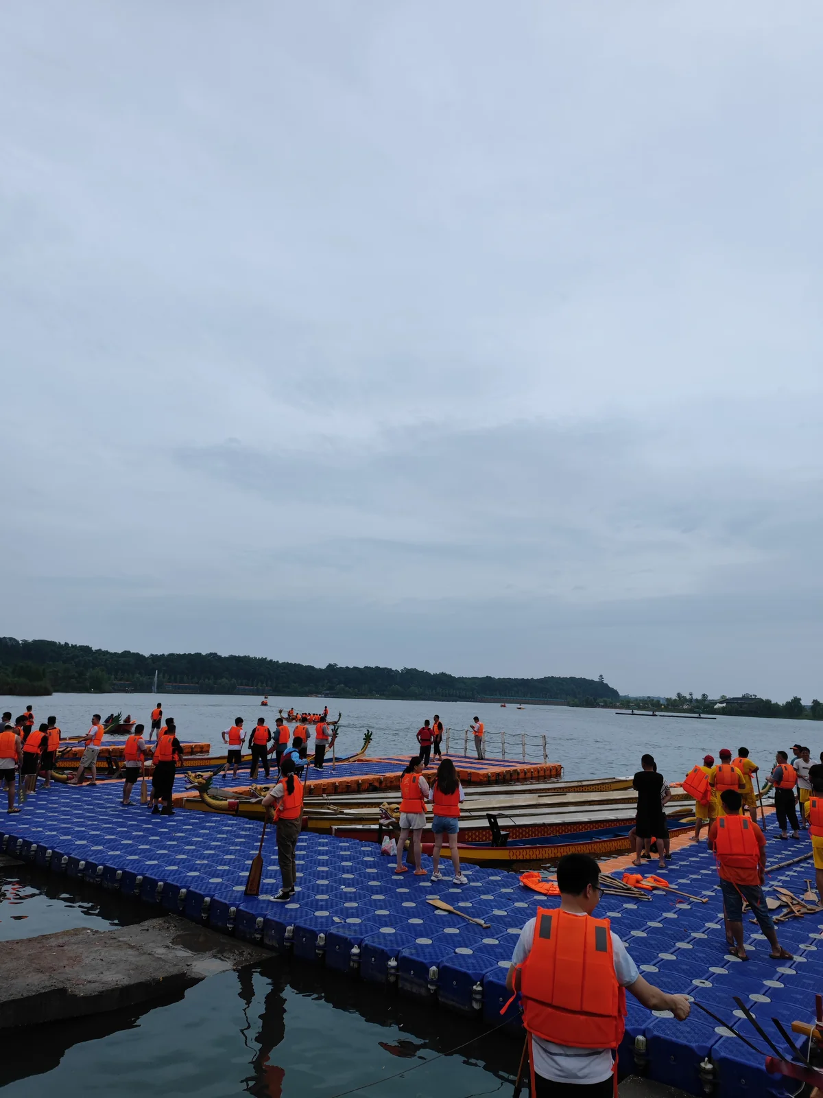 Dragon boats on the river in Miluo, Hunan. Credited documentary photograph.