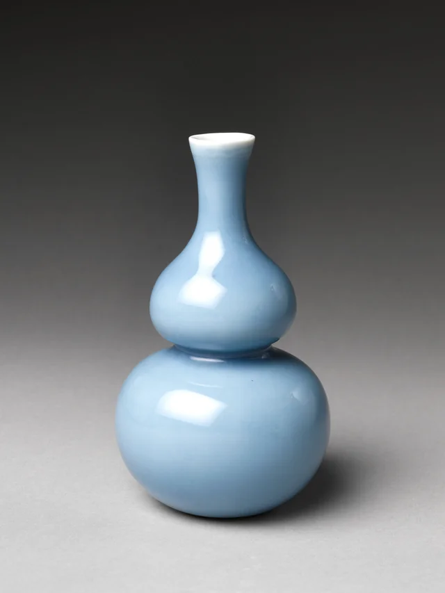 A pale blue gourd-shaped porcelain bottle made in Jingdezhen, early eighteenth century. The Met, 14.40.27.