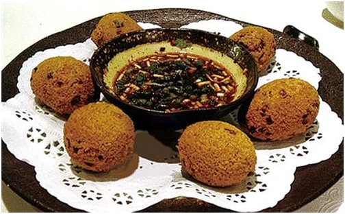Guiyang fried tofu balls arranged around dipping sauce; photograph supplied to the Guiyang municipal government portal, published in 2019.