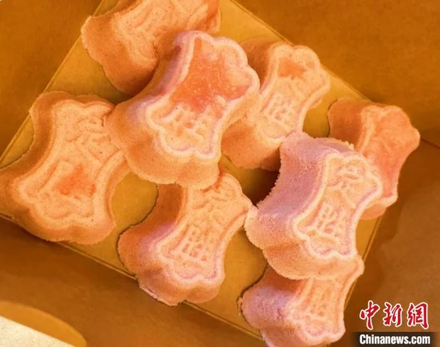 Pink moulded Dingsheng rice cakes made at a handicraft museum in Hangzhou.