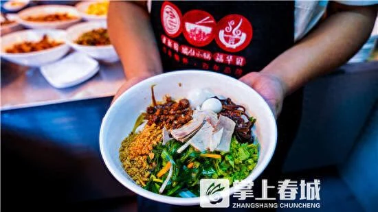 Kunming douhua rice noodles topped with soft tofu, herbs and savoury sauce.
