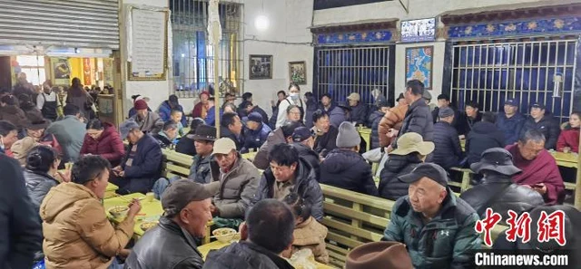 Customers drinking tea at Guangming Gangqiong sweet-tea house in Lhasa in December 2024.